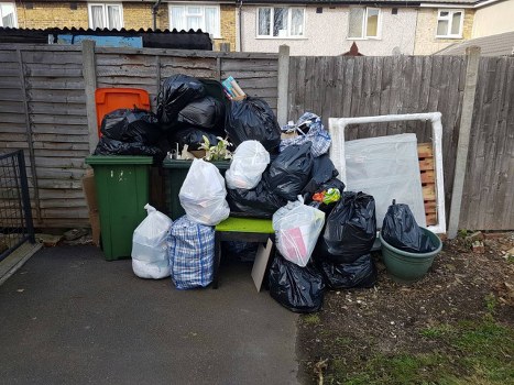 Heavy machinery involved in demolition waste removal in Carshalton