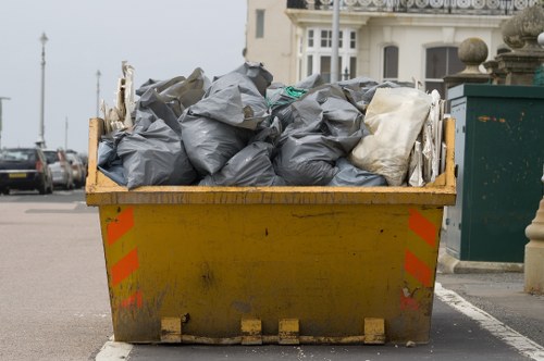 Construction site with waste materials ready for clearance in Carshalton