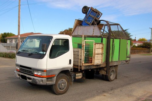 Two-person crew loading a van in a residential street