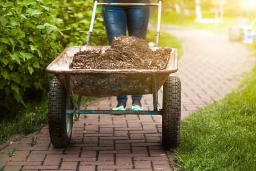 Builders managing construction debris efficiently